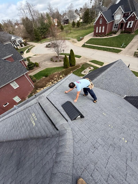 K&P Roofing team member performing a roof inspection for Louisville KY resident