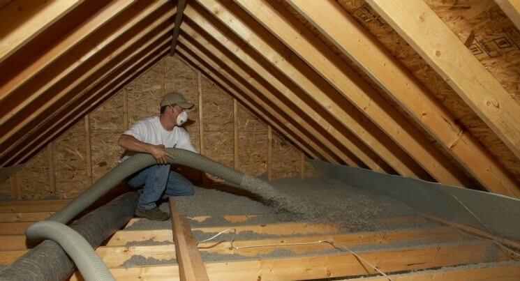image of insulation being installed in an Attic